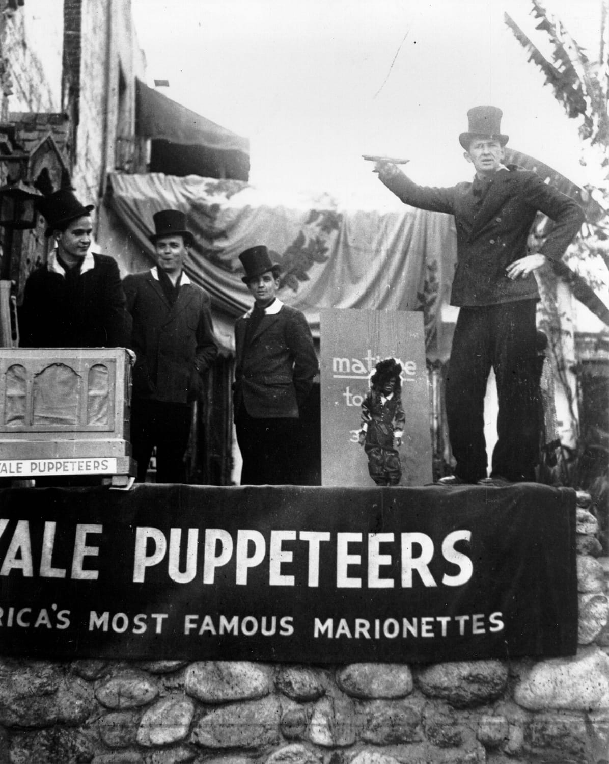The Yale Puppeteers and Beverly Brown attracting customers with "Douglas Fairbanks" outside of their Olvera Street theater, ca. 1930.