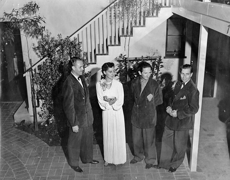 Forman Brown, Dorothy Neumann, Harry Burnett, and Roddy Brandon stand in the courtyard of the Turnabout on opening night.